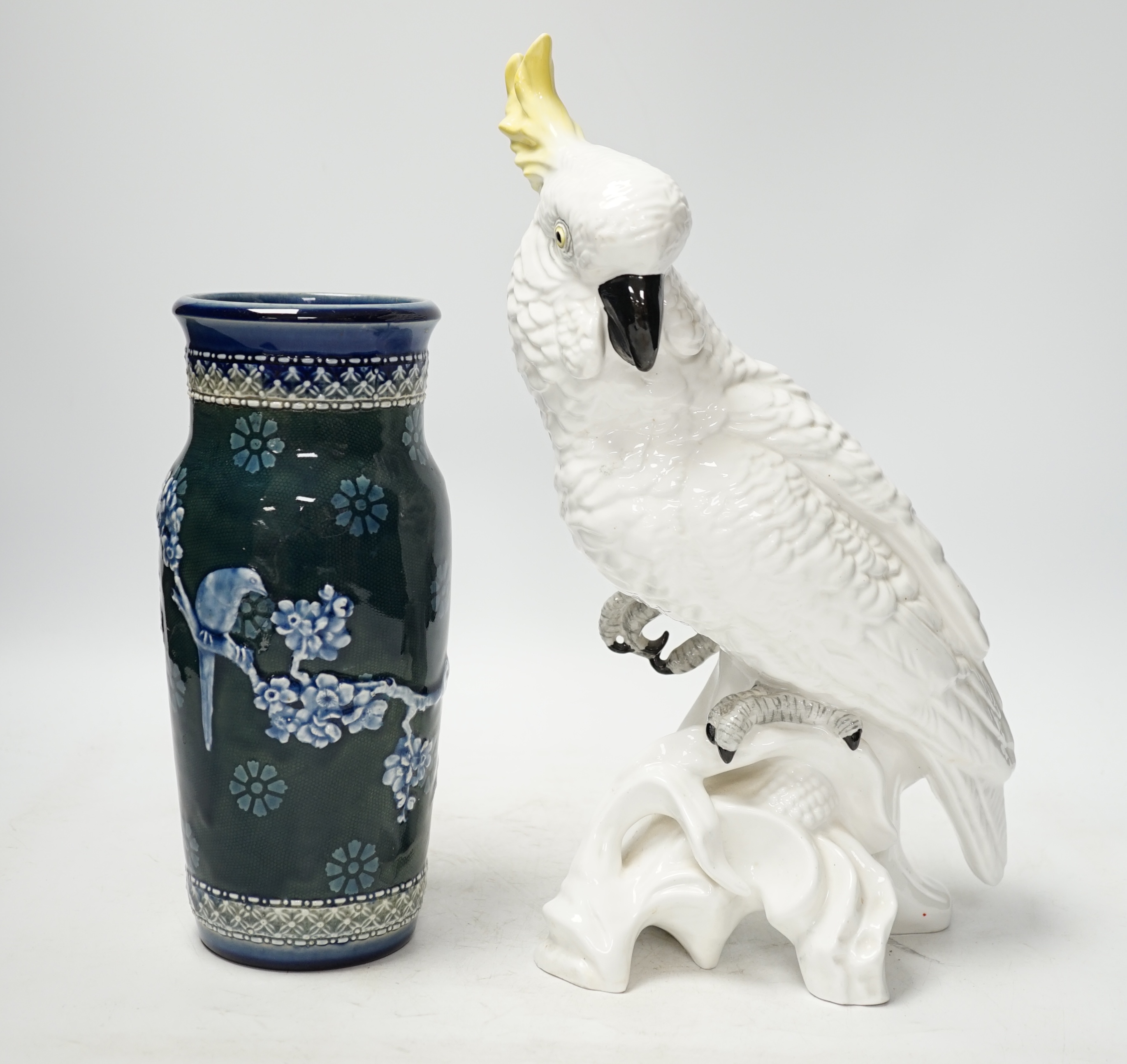 A Doulton and Slater’s patent stoneware vase and a Royal Staffordshire porcelain figure of a cockatoo, 33cm high. Condition - poor to fair condition, significant cracks to cockatoo